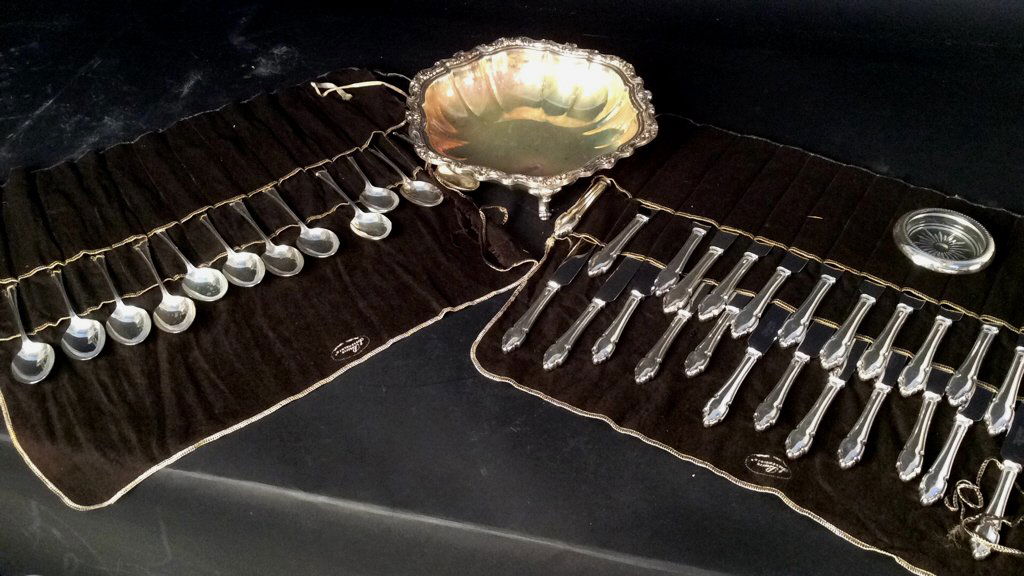 Partial Silver Plate Service with Scalloped Bowl: silver plate service includes 24 knives and 12 soup spoons . Each marked Cooper Brothers and Sons Sheffield England , also footed silver plate bowl diameter 12 inches and coaster.