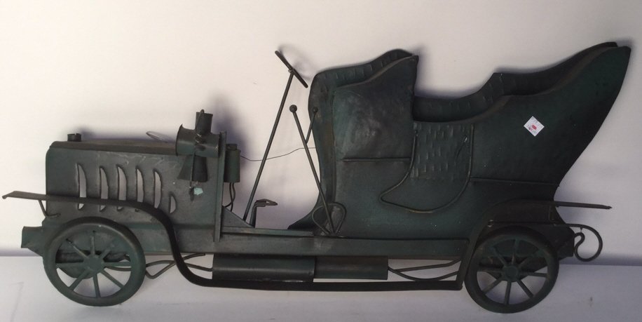 Antique Iron Car Wall Art: Antique iron wall art of antique car. Measures 31 inches wide by 15 inches high