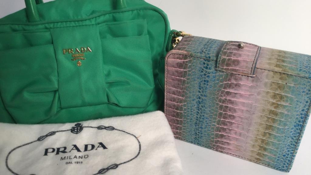 Green nylon Prada shoulder bag Tusk leather box: Prada shoulder bag in green nylon or across body bag, small tear, and colored striped leather box marked for Tusk . Bag measures app 8.5 by 5 without carry straps