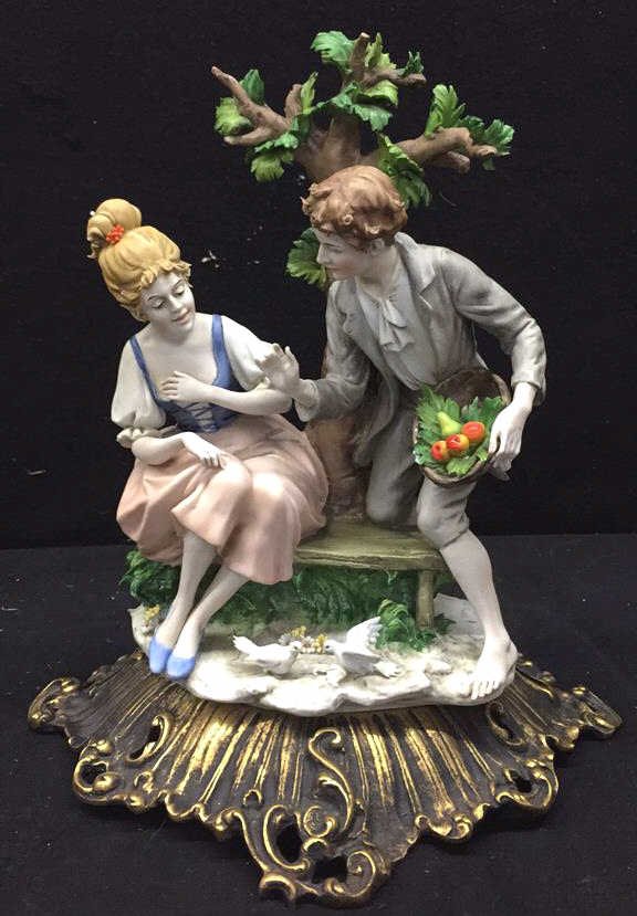 TRIADS Signed Stamped Figurine: Made in Italy garden scene on brushed bronze metal base. Doves and fruit basket male and female in period garments on a bench.