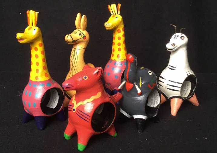 Hand painted Safari Napkin Rings: 6 animal themed hand painted napkin rings featuring giraffes camels elephants zebras and more. Minor damage to zebra. Tallest measures 6 inches high by 2 inches wide by 2 inches long.