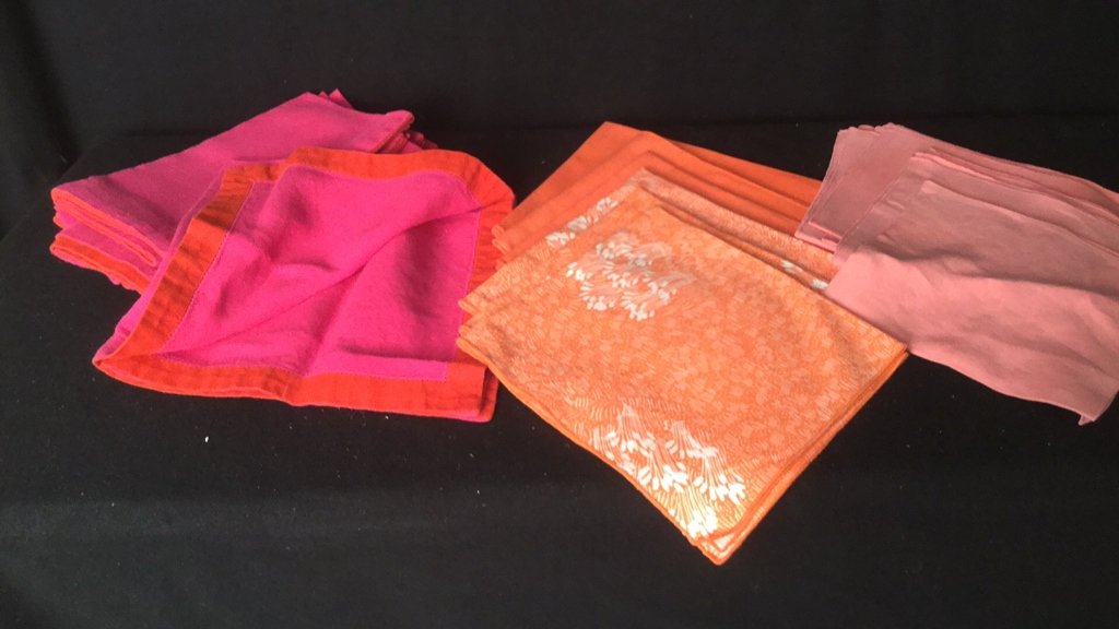 Bright Napkin Group lot: Set of pink and orange napkins of various size and color. 6 pink with orange boarder 3 orange 3 orange floral and 9 pink