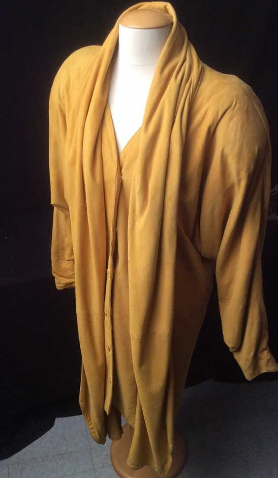 100% Vintage Lamb Swede Woman's Coat: 100 % Lambs Swede Lady's Coat, Mustard Yellow, soft shape and form, with drape collar and open fold front closer with inside v neck button and snap