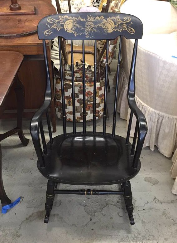 Black and Tan Accented Hitchcock Rocking Chair: Black rocking chair with tan accents on the head rest and top and bottom of the back, slight wear, measurements in inches are 22 across (arm to arm) and 37h