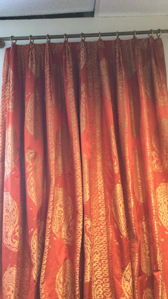 Elegant Set of Red and Gold Window Treatments: Elegant red curtains with gold paisley and stripes or ate designs. In a set of 3. Gold Curtain Rings. Each set measures aprox 100 inches high by 60 inches wide. Customer made. Great condition