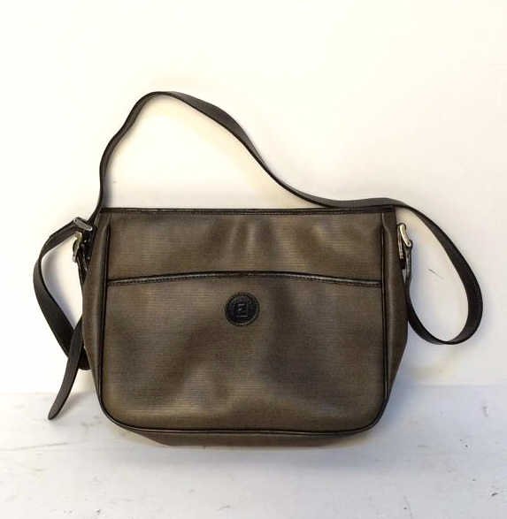 Adjustable Strap FENDI Purse: Brown Fendi purse with black inside, measurements of the purse itself in inches 12 x 9, bag marked Fendi, Italy, Roma, 1925, bag in great condition