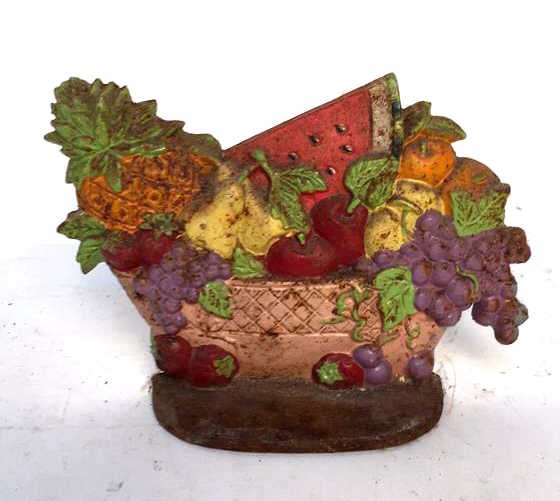 Vintage Antique Iron Door Stop: Fruit patterned iron door stop, condition consistent with age, door stop measuring in inches 8.75l x 6h