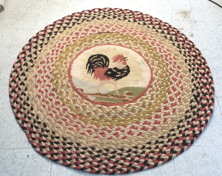 Vintage Circular Braid Pattern Rooster Rug: Vintage rug, circle, braid weaving design, rooster in middle, light rip on edge, separation of stitching made hole above rooster circle patch (see photo), measures in inches 48D