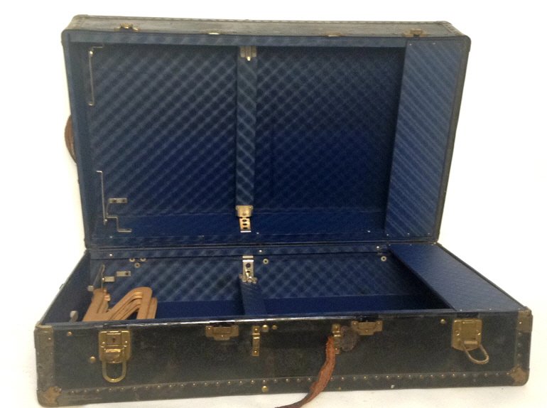 Vintage Continental Trunk: Vintage trunk marked Continental Trunk San Fransico U.S.A., Blue inside lining includes wood hangers and adjustable band with latch. Trunk measures in inches 20.5x34x12 condition consistent with age