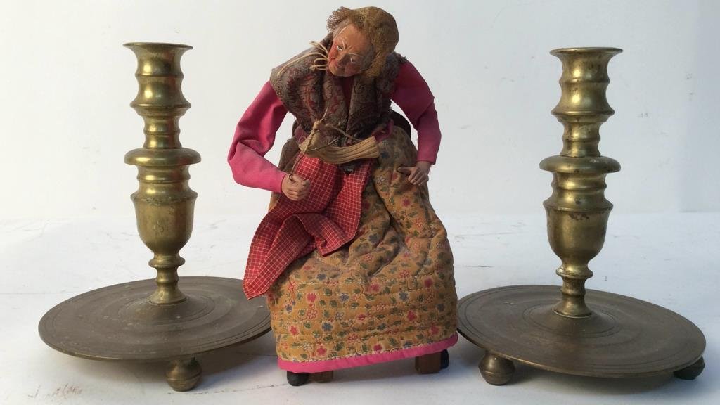 antique Denmark brass candlesticks and doll: pair of antique brass candlesticks ball feet saucer base and turned stalk each measures 9 inches height each signed for Denmark. Antique hand made pottery doll woman knitting height app 10 inches