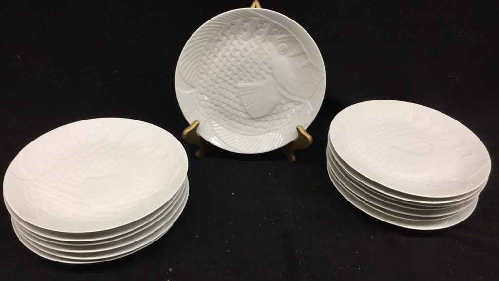14 Dansk White Fish Plates: Set of 14 Dasnk Salad Plates depicting fish. Marked for Dansk International Designs LTD France. Measures 9.5 inches across. Good condition.