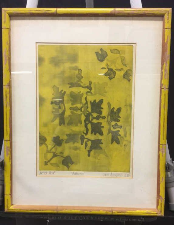 Autumn Leaves Double Matted Framed Artwork: Artwork of dark and light shaded leaves on a yellow backdrop. Yellow wooden frame and glass covering. Double matted surface. Patti Auerbach 1972, "Autumn". Claude Gallery Frames, Eastchester NY. Measu