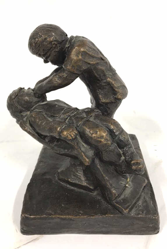 Signed KIRNIN Metal Dentist Sculpture: Patient reclining in chair with male figure working on seated person. Labeled replica. Measures 8 x 5-1/2 x 6