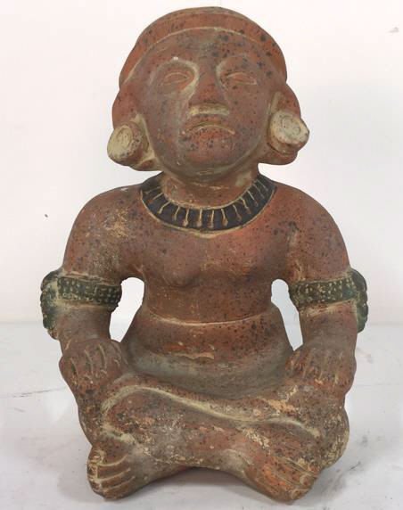 Terracotta Pre-Columbia Figure: Aztec style, Terra Cotta clay figure of nude lady. She is seated and cross legged width a necklace, earrings and arm bands. 10" h x 8" w 7" d