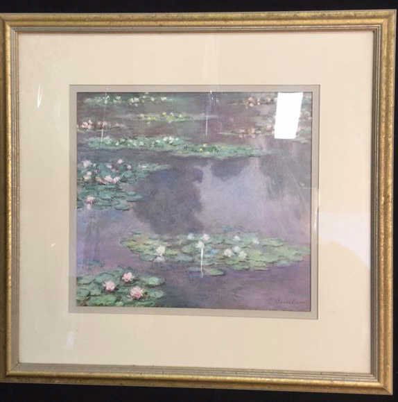Framed Claude Monet Waterl Lillies Print: Gold leafed carved frame professionally double matted print of Claude Monet Water lillies. Purchased in France. Measures app 14 by 15 inches
