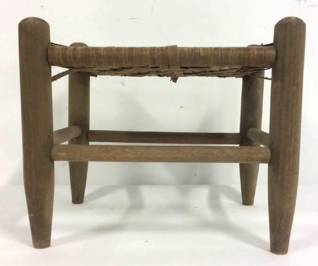 Handwoven Foot Stool: A wooden footstool for the legs and supports and handwoven rattan for the actual foot rest part. Measures 12 inches tall, 14 inches wide, and 11 inches deep. Damage to the rattan.