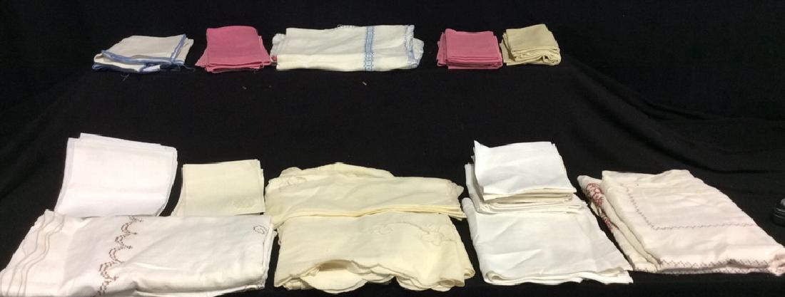 Group Lot 20 + Vintage Linens & Linen Napkins: Assortment of Linens and linen napkins of various colors with stitched designs, all starched and ironed