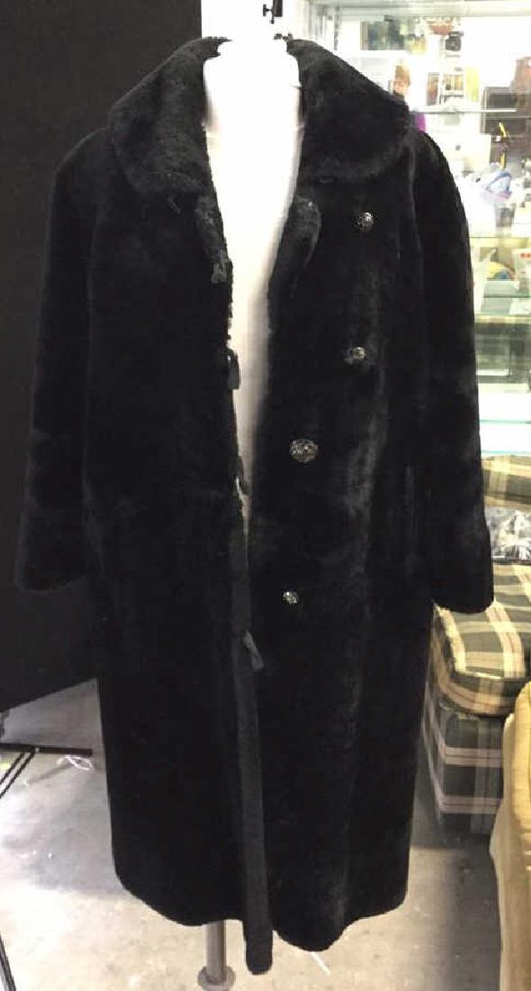 Vintage Faux Fur Coat: Black faux fur coat with collar and glass buttons. Fully lined and monogrammed "CA". Label reads ""Label Authority Consumer Protection FLA Manufactured Under Labor Standards Y252433. Measures 16 inche