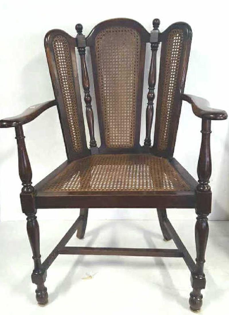 Antique Mahogany Caned Butterfly Armchair: Antique Caned Butterfly Armchair. Butterfly seat back with three panels. Caned seat back and seat. Block and spindle legs. 3 stretchers. Some wear to the wood. Very minor wear on the cane. Measurement