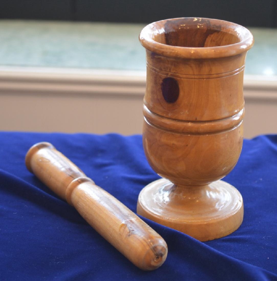 Wooden Mortar & Pestle Apothecary Grinder: Mortar is 7.5" H made of cedar wood & finished with sealer. Pestle is 9" L made of cedar, unsealed.