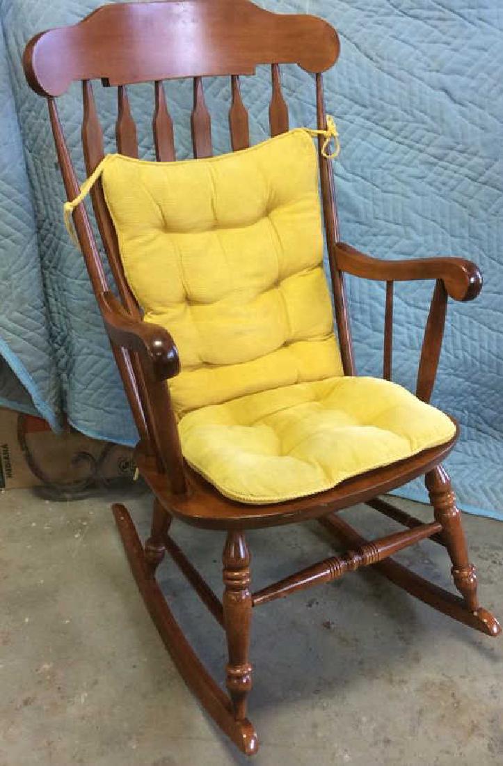 Nichols & Stone Carved Wood Rocking Chair Signed and: Signed and trademarked Nichols and Stone Gardner Mass, numbered 566B- 070. Northern Hardwood. Chair has loose tied cushions for seat and back. Measures ht 43 inches width 24 inches depth 31 inches. Pr