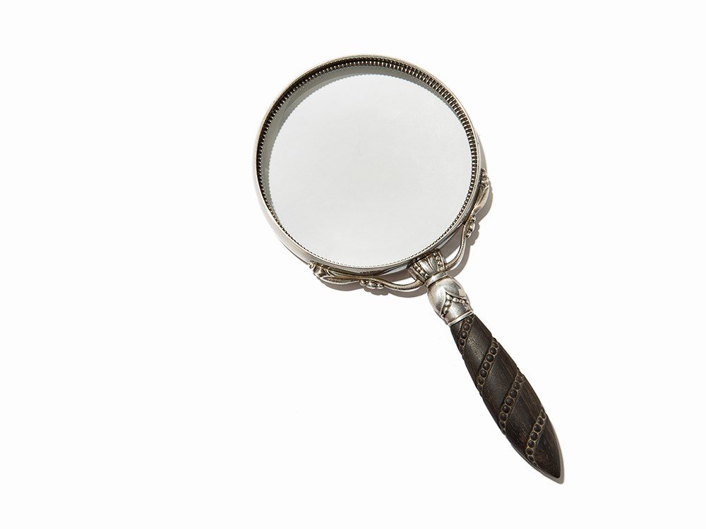 Georg Jensen, Magnifying Glass, Sterling silver,: Sterling silver, wood, glass Denmark, mid 20th century Georg Jensen Stamped ‘GEORG JENSEN (in dotted oval)/STERLING/DENMARK/74/C’ Sterling silver magnifying glass with carved wood handle Dimension