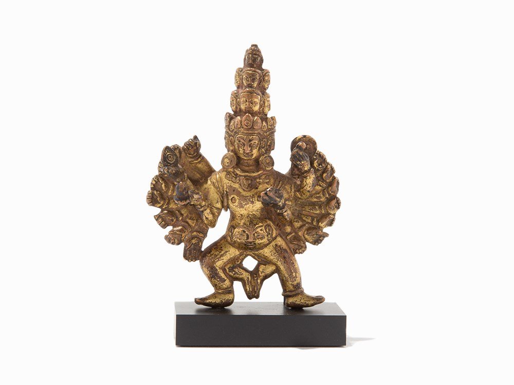 Buddhist Deity, Nepal or Tibet, Likely 15th C.: Gilt copper Nepal or Tibet, likely 15th century Stand dimensions (height x width x depth): 4 ½ x 3 x 1 ¼ in. (11.4 x 7.6 x 3.2 cm) Good condition This gilt copper Buddhist deity has twenty-two arms 