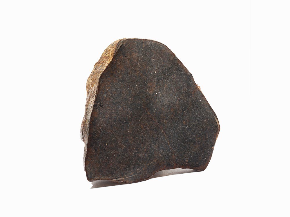 Unclassified Stone Meteorite Polished End Cut, Africa: Unclassified chondrite Sahara Desert, Northwest Africa Dimensions (height x length x depth): 4 x 4 1/8 x 1 5/8 in. (10.16 x 10.47 x 4.12 cm) Total weight: 1.16 lbs. (528 g) Provenance: Geoffrey Notkin