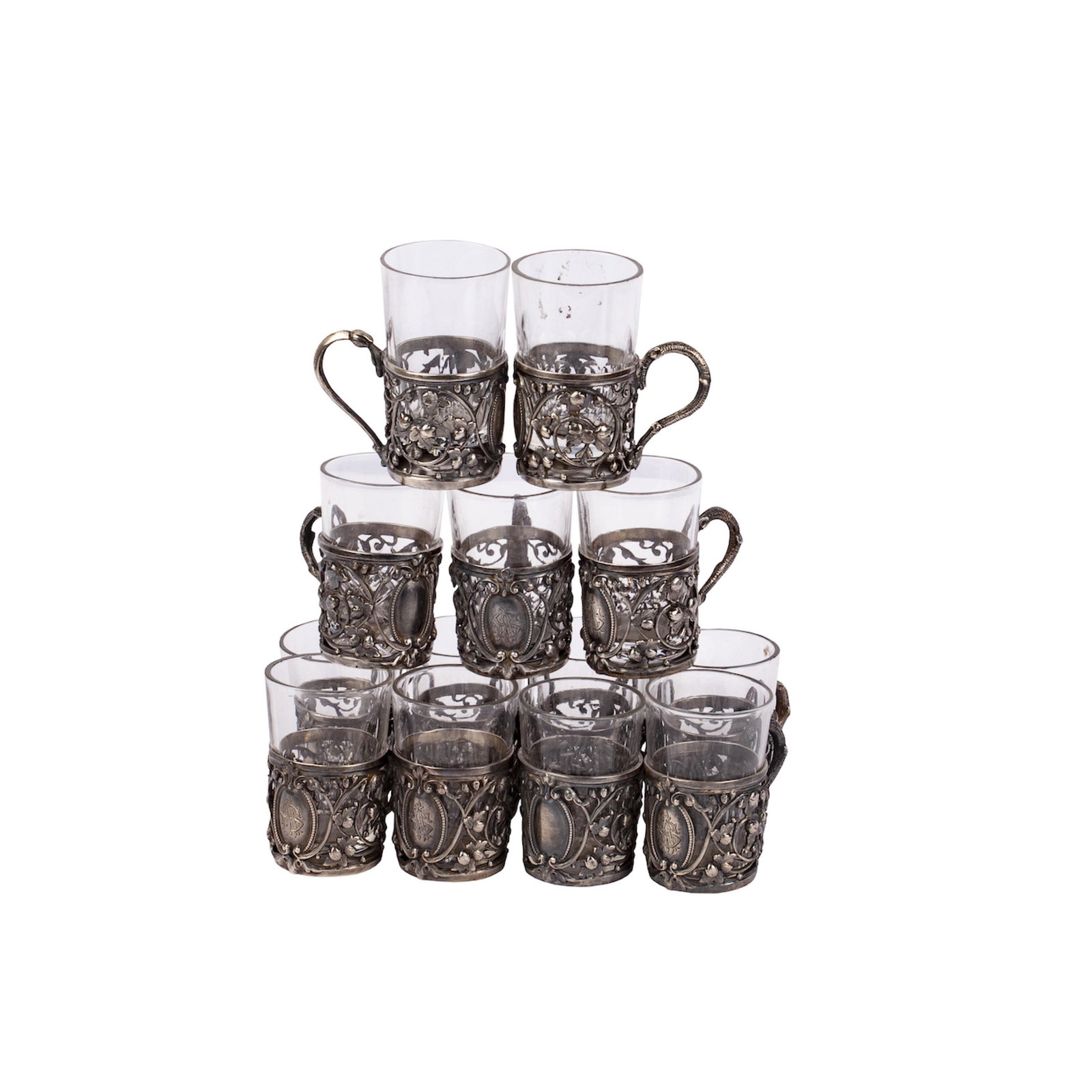 A Russian art nouveau style silver-gilt beakers set: A Russian art nouveau style silver-gilt beakers set (13 pc). Makers mark of Imperial Court supplier I. Khlebnikov. Moscow, 1908-1917. Dimensions: 5.5 x 5 x 3.7 cm.