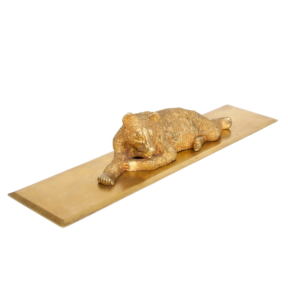 A Russian gilt bronze paperweight â€œLying bearâ€: A Russian gilt bronze paperweight "Lying bear". By the N. Liberich model. Russia, second half of the 19th century. Dimensions: 5 x 26 x 6.5 cm.