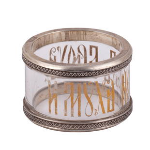 A rare Faberge silver and glass napkin ring with a proverb: A rare Faberge silver and glass napkin ring with a proverb "And a fly is not without belly". Makers mark of K. Faberge firm. Moscow, the end of the 19th century. Weight: 103.7 g. Diameter: 6 cm.