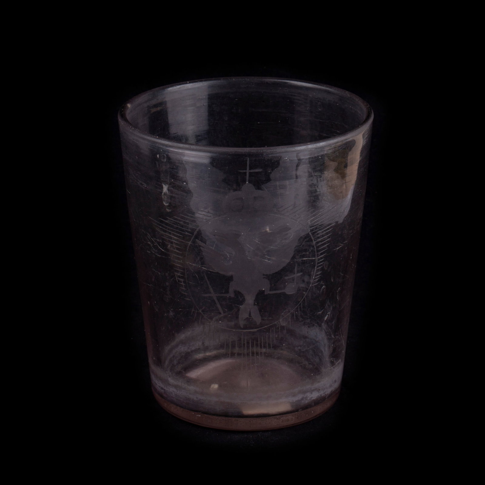 Glass with Double-Headed Eagle. Russia, first half of the 18th century: Glass with a Double-Headed Eagle Russia, first half of the 18th century Transparent glass; blown and engraved Dimensions: Height 13.3 cm. Rim diameter 10.7 cm A finely crafted glass featuring an engra