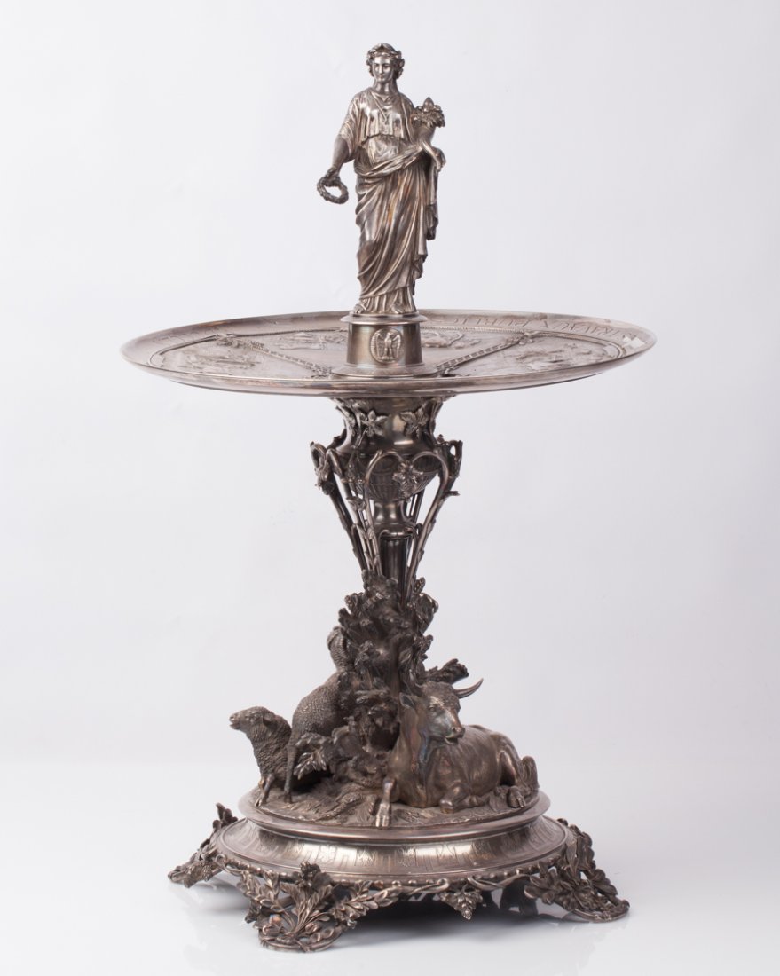 French Silver figural Centerpiece. Christofle: French silver figural Centerpiece. Christofle. France, Paris, ca.1866. Silver. Agricultural prize. With a minor scratches. Weight: 9700 gr. Height: 70 cm.