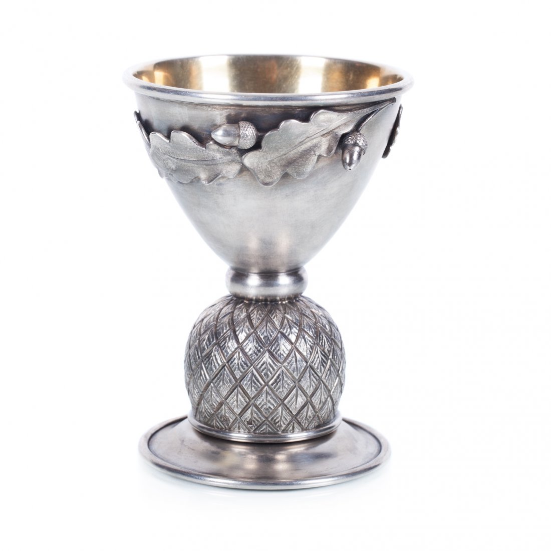 Russian silver goblet. Faberge workshop. A. Wakeva.: Goblet in "art-noveau" style. Silver, gilding, chasing, engraving. Petersburg, Faberge workshop with makers mark of Alexander Wakeva. 1908-1917. Weight: 371.8 gr. Dimensions: 13 X 9.5 cm.