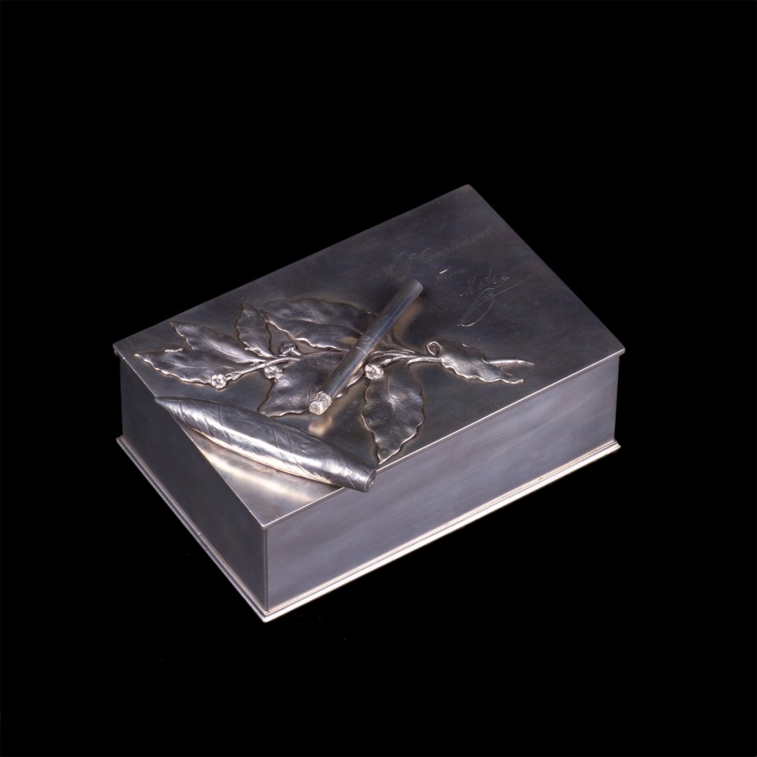 Very unusual Russian silver-gilt cigar box. Pogorzelski: Very unusual Russian silver-gilt cigar box with cast silver models of the cigar and cigarette on the lid. Maker's mark of Pogorzelski. Minsk, 1862-1866. Dimensions: 8 x 19 x 12.5 cm. Weight: 861.5 g.