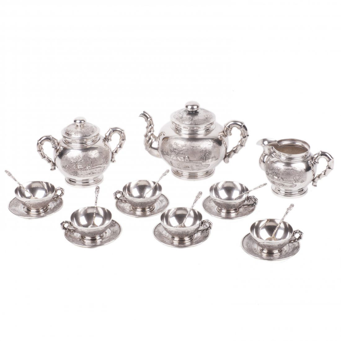 Antique Vietnam sterling silver tea set of 21 pieces: Antique sterling silver Vietnam tea set of 21 pieces. Beautiful engraving on silver. Vietnamese hallmark, H-T-X, 900 proof. 19th century. Total weight: 2061 g. Height of the kettle: 15 cm. 6 cups, 6 s