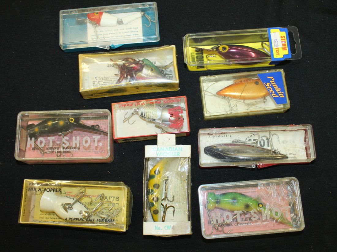 10 Fishing Lures in Boxes: Includes 2 Hot-Shots, Arbogast Hula Popper, Cordell's Th' Spot, Canadian Wiggler, Heddon Tiny Crazy Crawler, Arbogast Hawaiian Wiggler, Pflueger Watusi, Punkin Seed and a lure by Storm Lures.