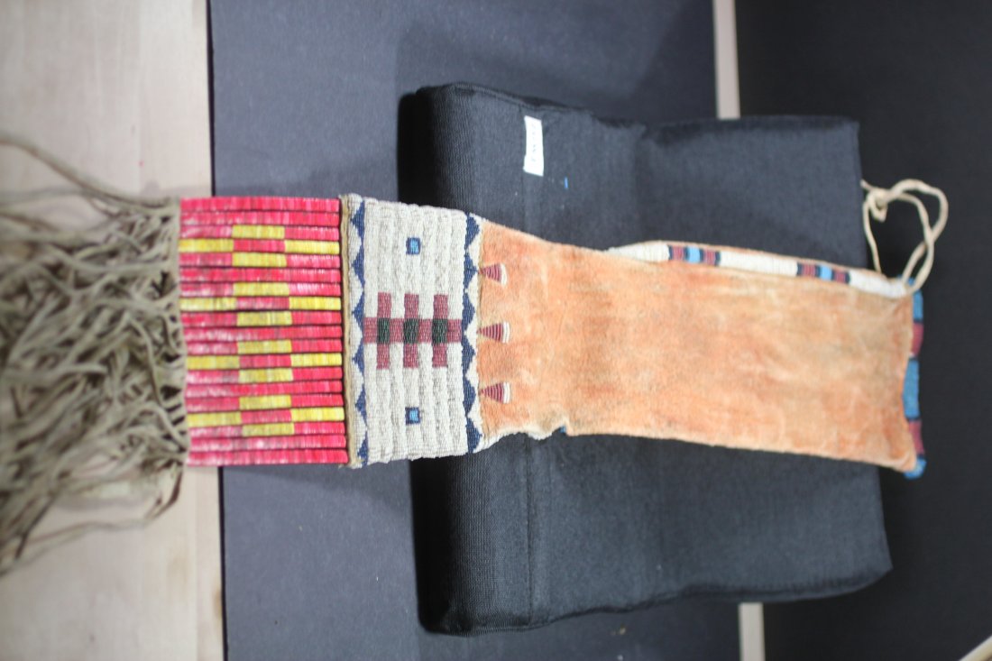 31"L BEADED/QUILL SIOUX PIPE BAG: I'm guessing it is Sioux Geometric Design Bag, Northern Plains with white beads, etc. grass wrapped porcupine quill panel below with animal hide fringe at the bottom. Condition looks great, but the le