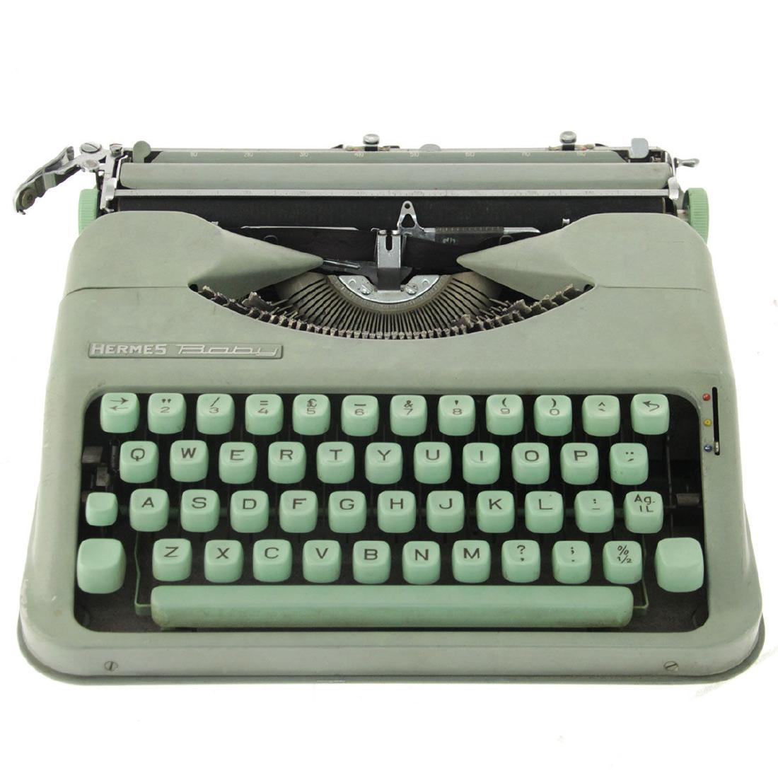 Vintage Hermes Baby Typewriter.: Vintage Hermes Baby Typewriter. Original case. Good working condition. English.With Israeli Lira and Agorot button. Made in Switzerland. 29x29cm.