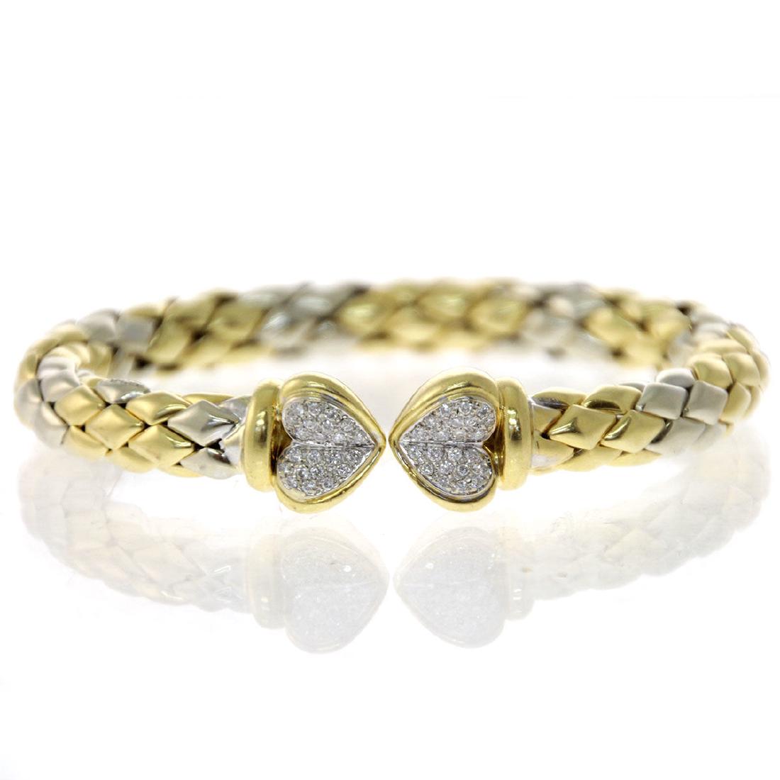 Chimento 18k Yellow and White Gold Diamond Bracelet.: Chimento 18k Yellow and White Gold Diamond Bracelet. Coil bracelet with two heart shape terminals set with 44 diamonds in total weight of about 0.50ct. Inner circumference: 17cm. 48.15gr.