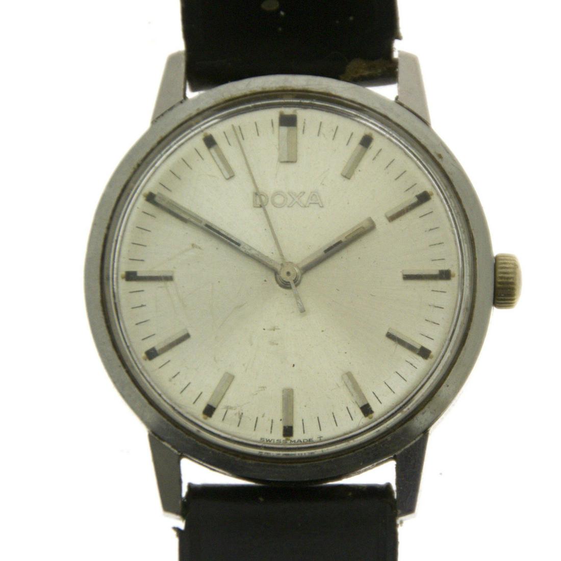 Doxa Wrist Watch.: Doxa Wrist Watch. Mechanical movement. Leather strap (worn). Working condition. 35mm. Ref: 10368-4