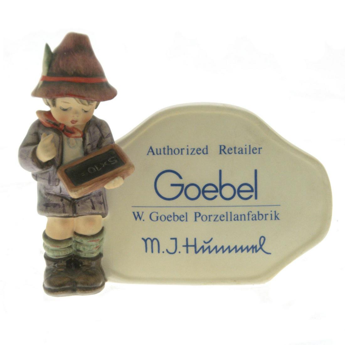 Goebel M.J. Hummel Authorized Retailer Porcelain: Goebel M.J. Hummel Authorized Retailer Porcelain Figurine. Marked. Height: 13cm. Length: 15cm.