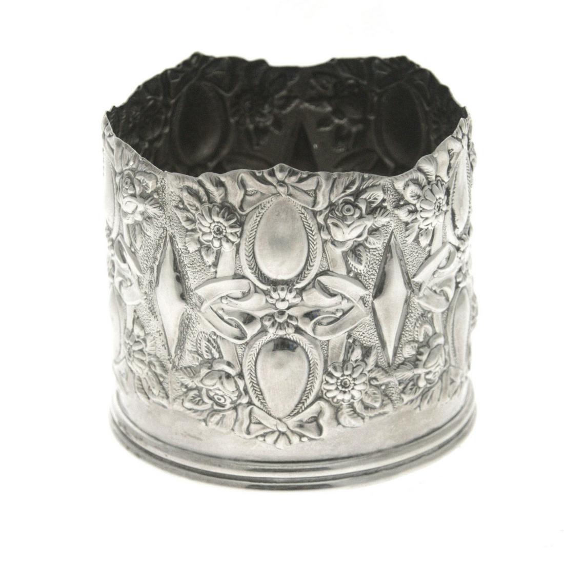 Sterling Silver Wine Bottle Coaster.: Sterling Silver Wine Bottle Coaster. Marked. Height: 7.5cm. Diameter: 8.5cm. <