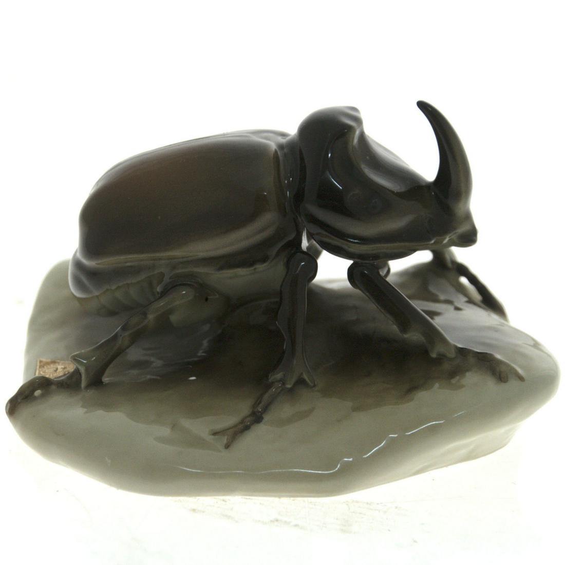 Royal Dux Porcealain Rhino Beetle Figurine,: Royal Dux Porcealain Rhinoceros Beetle Figurine, Czechoslovakia, 20th Century. Marked. Length: 14cm. Height: 8cm.