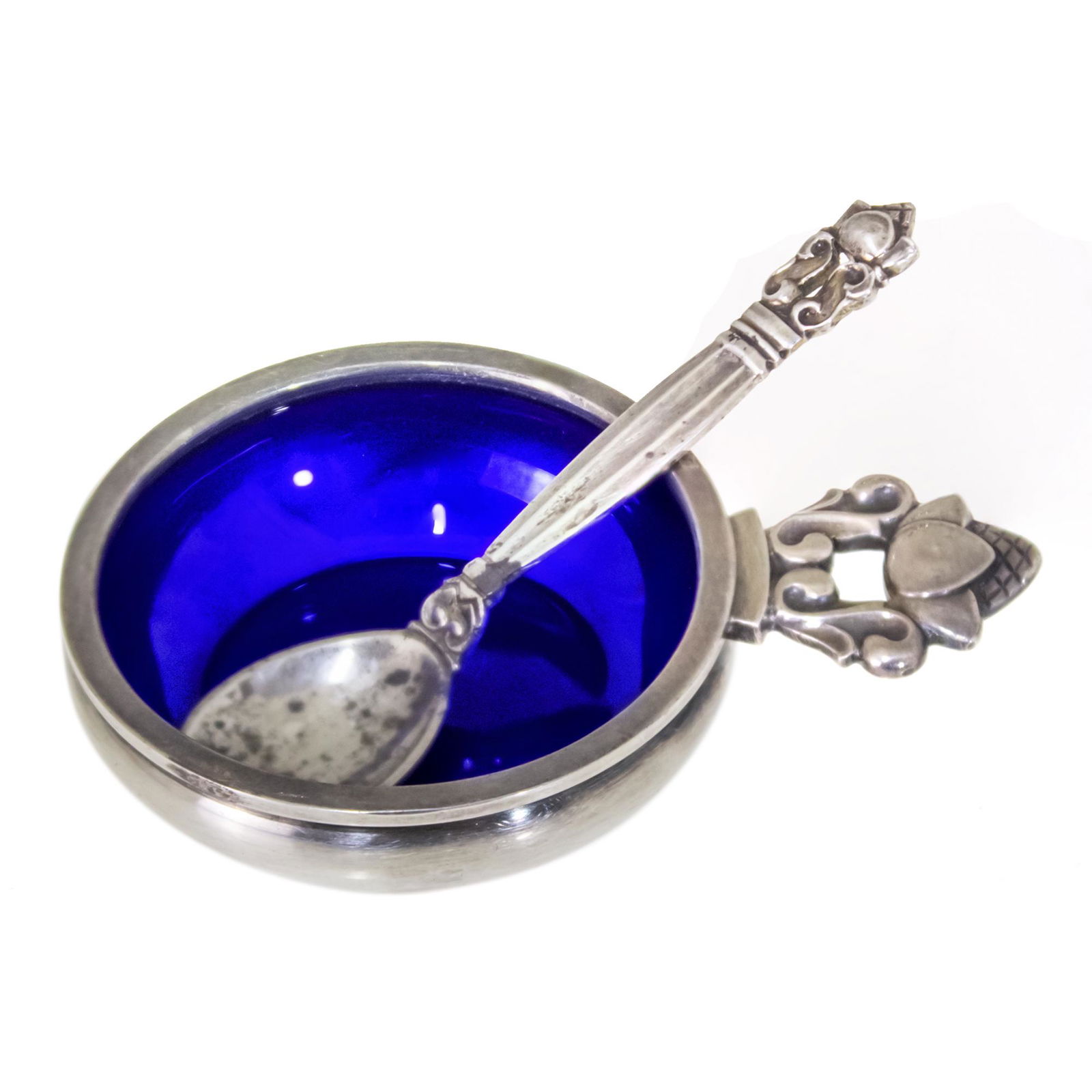 Georg Jensen Sterling Silver and Enamel Acorn Salt Cellar and Spoon.: Georg Jensen Danish Sterling Silver and Enamel Acorn Salt Cellar and Spoon. Both with Jensen famous acorn pattern handles. Salt with blue enamel interior. Marked. Spoon length: 6cm. Salt length: 6.2cm