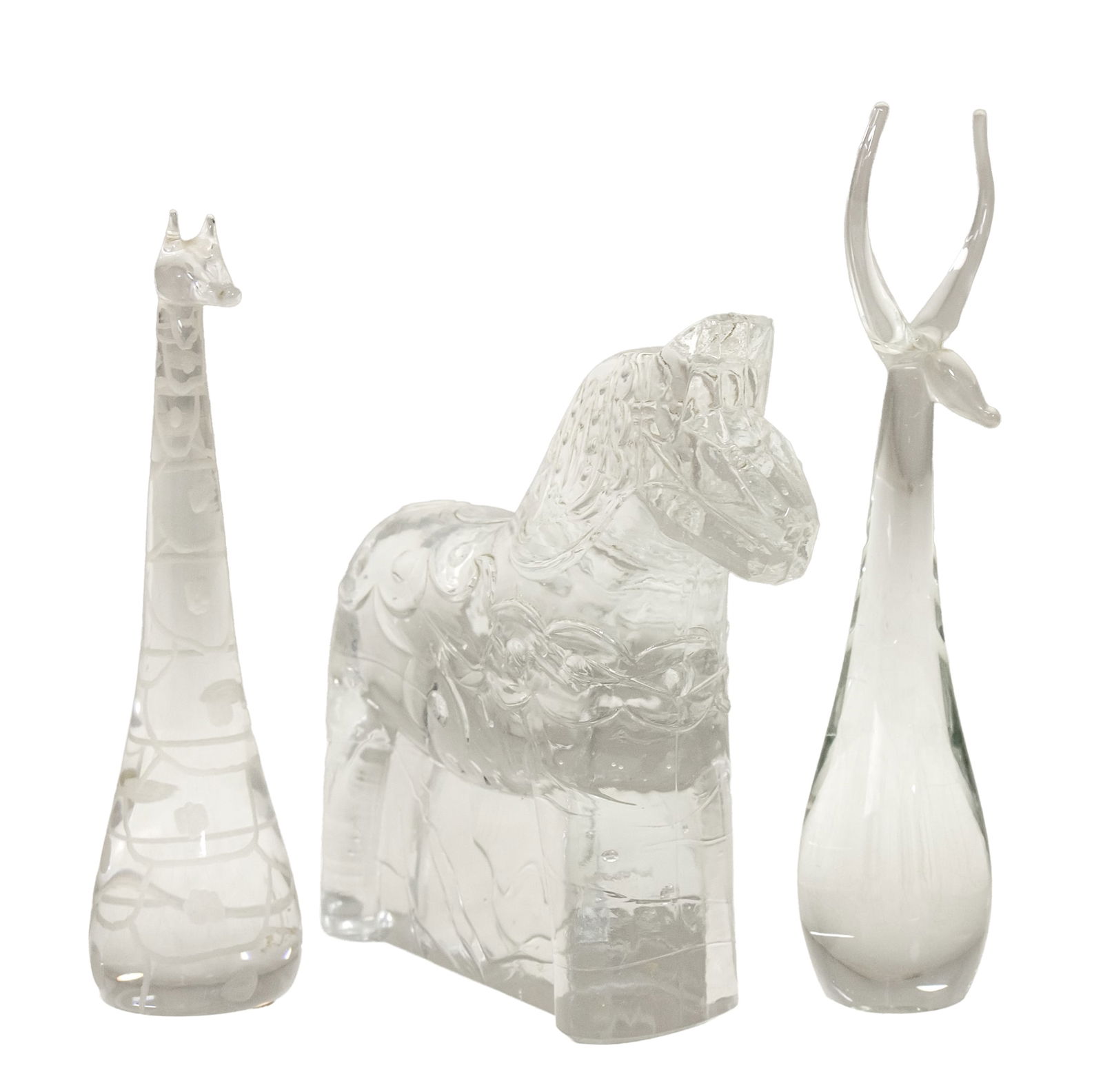 Lot of Three Glass Figures.: Lot of Three Glass Figures. Including: Christer Sjogren (Sweden, 1926-2008) - Horse figure made in Lindshammar, signed, height: 15cm. Vicke Lindstrand (Sweden, 1904-1983) - for Kosta Boda, giraffe fig