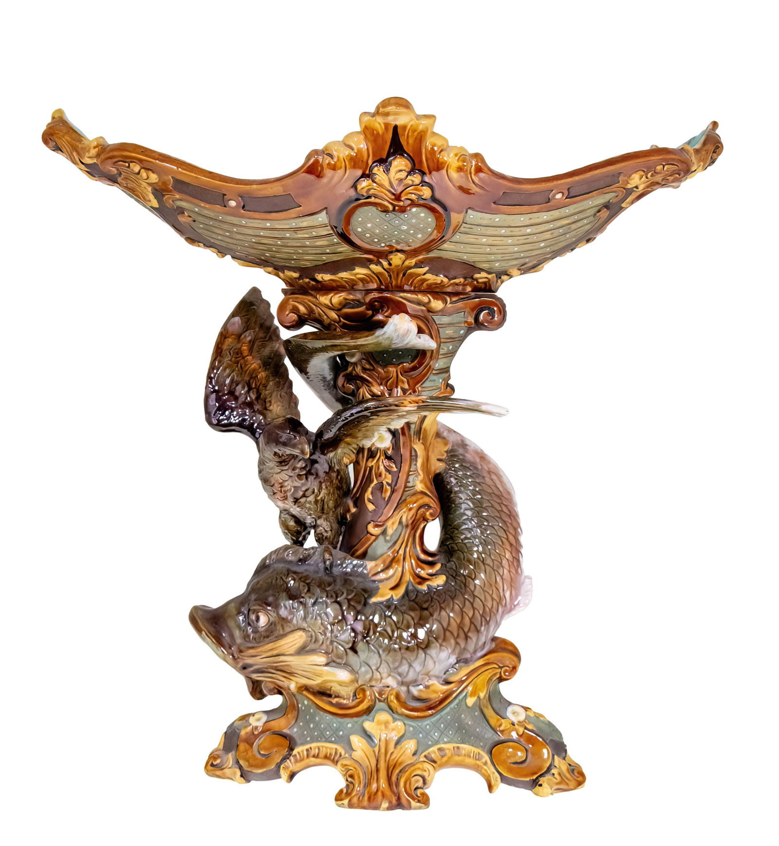 Wilhelm Schiller & Son Majolica Centerpiece, Germany, Circa 1900.: Wilhelm Schiller & Son Majolica Centerpiece, Germany, Circa 1900. Modeled with a dolphin and a hawk holding a bowl on the top. Marked. 42x26x42cm.