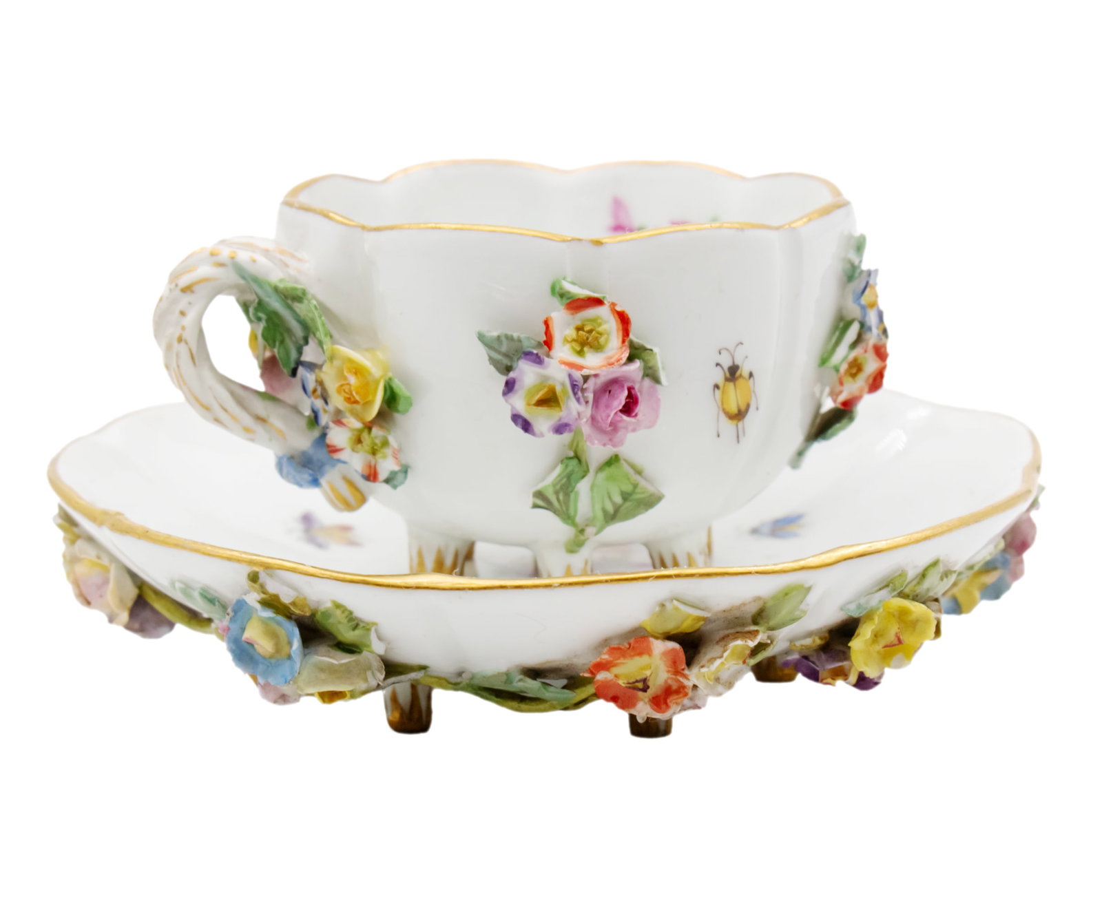 Meissen Porcelain Demitasse Cup and Saucer, Germany, Circa 1880.: Meissen Porcelain Demitasse Cup and Saucer, Germany, Circa 1880. Six Footed Cup and Saucer. Tiny clusters of flowers are hand applied around the outside of the cup and bottom of the saucer. The handle