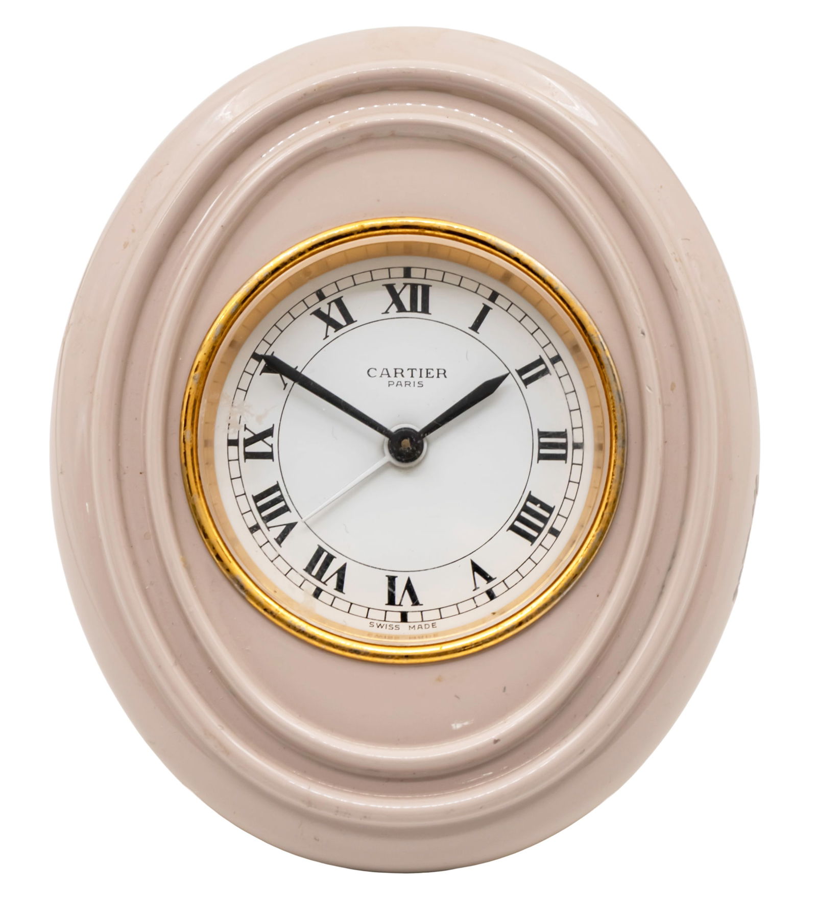 Cartier Table Alarm Clock.: Cartier Table Alarm Clock. Oval form with pink enamel frame. Mechanical movement, working condition, alarm movement functioning. Roman numerals. Back easel on hinge, supports modeled as the company lo