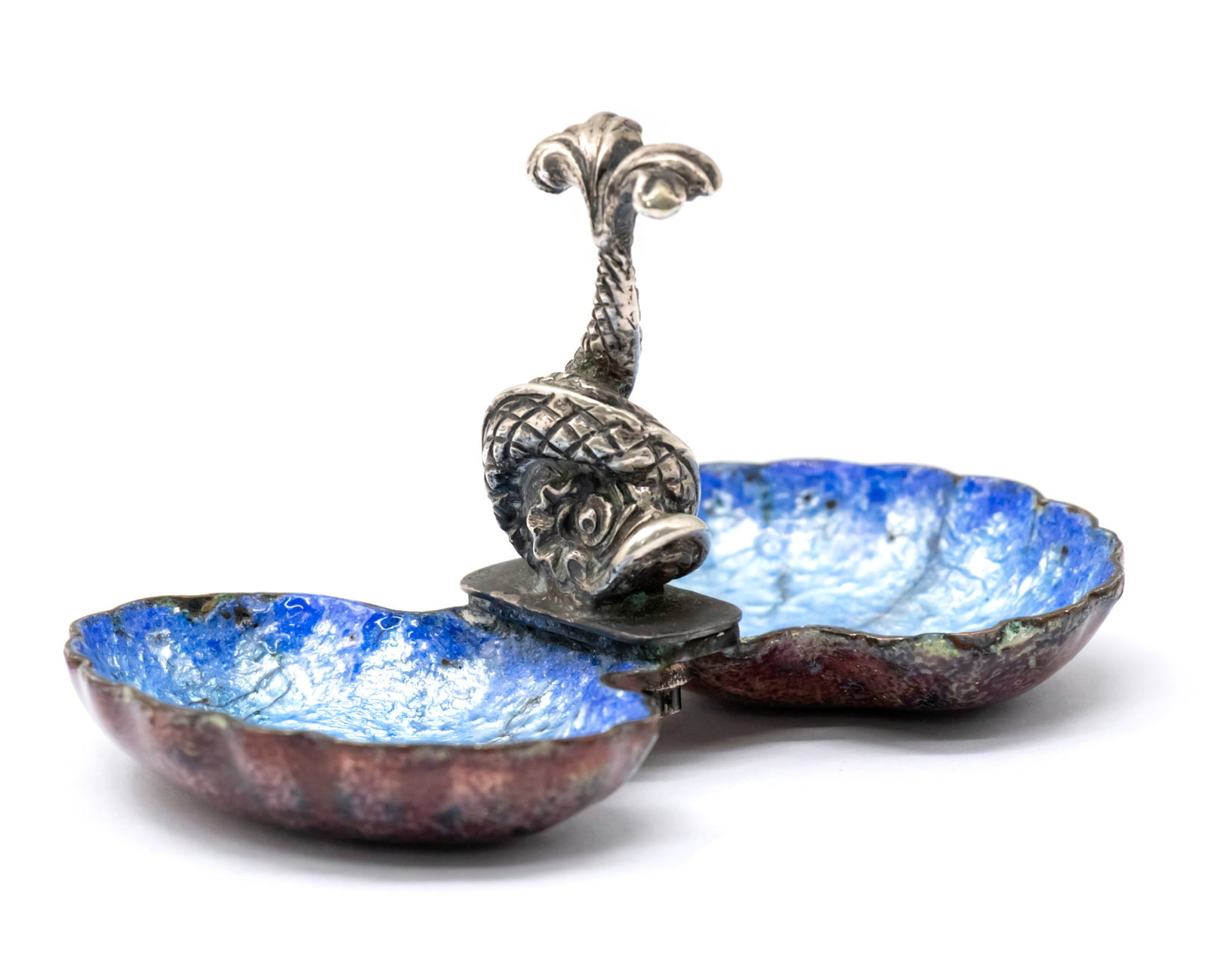 Silver and Enamel Double Salt Cellar.: Silver and Enamel Double Salt Cellar. Modeled with sculptured fish in the center, two shell shaped bowls with charming blue enamel. Marked (800). Height: 5cm. Length: 10cm. 95gr.